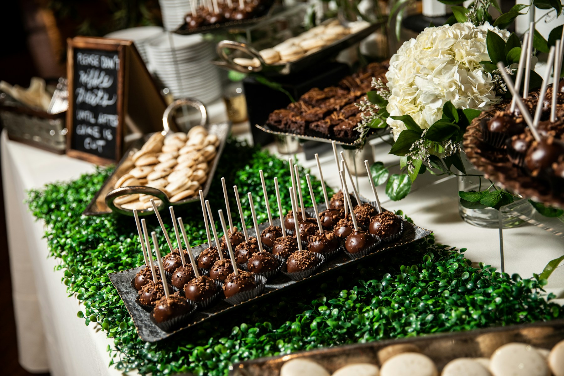 Long dessert table arranged for a celebration